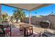 Outdoor patio area with a dining table, seating, grill, and covered for shade and comfort at 7079 S Kachina Dr, Tempe, AZ 85283