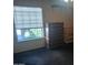 Bedroom with a large window, dresser, and carpeted floor at 8020 E Thomas Rd # 313, Scottsdale, AZ 85251