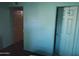 Hallway with two interior doors in different paint colors at 8020 E Thomas Rd # 313, Scottsdale, AZ 85251