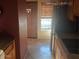 Kitchen featuring tiled floor, stainless steel refrigerator, and wooden cabinets at 8020 E Thomas Rd # 313, Scottsdale, AZ 85251