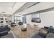 Comfortable community lounge area with modern furniture, fireplace and bar seating at 8055 E Thomas Rd # A102, Scottsdale, AZ 85251