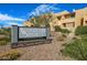 Woodland Springs Condominiums community sign surrounded by lovely landscaping at 8055 E Thomas Rd # A102, Scottsdale, AZ 85251