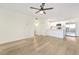 Inviting living room area with views of the kitchen and sleek, modern flooring at 8055 E Thomas Rd # A102, Scottsdale, AZ 85251