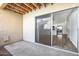 Outdoor patio with a view into the home's interior, showcasing the kitchen and living area at 8055 E Thomas Rd # A102, Scottsdale, AZ 85251