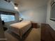 Bedroom featuring a bed, dark wood furniture and natural light from the window at 8269 E Desert Trl, Mesa, AZ 85208