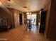 Dining room featuring a wood table with matching chairs, wood-look floors, and a light fixture at 8269 E Desert Trl, Mesa, AZ 85208