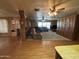 Open floor plan with living area, built-in storage, and wood-paneled walls at 8269 E Desert Trl, Mesa, AZ 85208