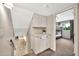 Upstairs hallway with built in storage and view to a bedroom with bunk beds at 8338 E Stella Ln, Scottsdale, AZ 85250