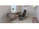 Cozy home office featuring a modern desk, comfortable chair, and calming neutral tones at 9832 W Agora Ln, Tolleson, AZ 85353