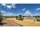 Neighborhood playground with slides, a swing set, and a pea gravel base at 9832 W Agora Ln, Tolleson, AZ 85353