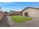 Expansive backyard featuring a well-maintained lawn, a desert cactus, playground and basketball hoop at 10721 W Jefferson St, Avondale, AZ 85323