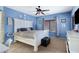 Spacious bedroom featuring a ceiling fan, large windows, and carpet flooring at 10721 W Jefferson St, Avondale, AZ 85323