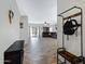Open-concept entryway with neutral tones leads to a spacious living area with a ceiling fan at 10721 W Jefferson St, Avondale, AZ 85323