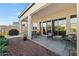 Back patio area with modern furniture and landscaped yard at 11241 N Blakely St, Surprise, AZ 85388