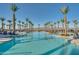 Spacious pool area with palm trees and comfortable seating at 11241 N Blakely St, Surprise, AZ 85388