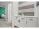 Hallway featuring built-in cabinets and a decorative vase with flowers at 11241 N Blakely St, Surprise, AZ 85388