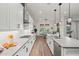 Bright and open kitchen with stainless steel appliances, modern cabinets, and a view to the dining area at 11241 N Blakely St, Surprise, AZ 85388