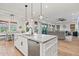 Spacious kitchen with island, stainless dishwasher, and views of the living and dining areas at 11241 N Blakely St, Surprise, AZ 85388