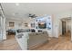 Spacious living room with a large ceiling fan and decorative built-ins at 11241 N Blakely St, Surprise, AZ 85388