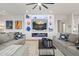Modern living room with built-in shelving, fireplace, gray sofas, and neutral rug at 11241 N Blakely St, Surprise, AZ 85388