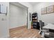 Office space showing wood-look tile floors and a doorway to another room at 11241 N Blakely St, Surprise, AZ 85388