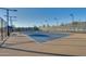 Bright and sunny view of a pristine community tennis court at 11241 N Blakely St, Surprise, AZ 85388