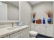 Stylish half-bathroom with modern fixtures, decor, and unique hexagon tile flooring at 11673 N 136Th St # 1019, Scottsdale, AZ 85259
