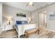 Bright bedroom with a queen bed, art piece, and stylish decor at 11673 N 136Th St # 1019, Scottsdale, AZ 85259