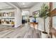 Inviting foyer with wood flooring, stylish decor, and a glimpse into the open-concept living space at 11673 N 136Th St # 1019, Scottsdale, AZ 85259