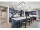 Modern kitchen features stylish blue cabinets, stainless steel appliances, quartz countertops, and sleek pendant lighting at 11673 N 136Th St # 1019, Scottsdale, AZ 85259