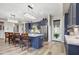 Modern kitchen featuring stylish blue cabinets, stainless steel appliances, a large island, and pendant lighting at 11673 N 136Th St # 1019, Scottsdale, AZ 85259