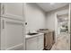 A clean and functional laundry room with modern appliances and ample storage space at 11673 N 136Th St # 1019, Scottsdale, AZ 85259