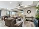 Open-concept living room with modern decor, fireplace, and sliding doors to outdoor patio at 11673 N 136Th St # 1019, Scottsdale, AZ 85259