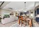 Open-concept living room with dining area, stylish furnishings, and modern lighting at 11673 N 136Th St # 1019, Scottsdale, AZ 85259