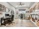 Bright office space with dual workstations, guitars, and ample wall decor at 11673 N 136Th St # 1019, Scottsdale, AZ 85259