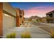 Inviting street view showcases modern home exteriors with desert landscaping and scenic mountain backdrop at 11673 N 136Th St # 1019, Scottsdale, AZ 85259