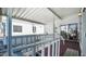 Relaxing covered porch with seating and white railings overlooking the neighborhood at 117 Kaolin Dr # 117, Apache Junction, AZ 85119