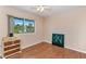 Bedroom featuring hardwood floors, a large window, and neutral-colored walls at 12202 N Hacienda Dr, Sun City, AZ 85351