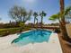 This backyard features a lovely pool, lush landscaping, and plenty of space for relaxation at 12403 W Monte Vista Rd Rd, Avondale, AZ 85392