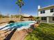 Relaxing backyard featuring a sparkling pool and lush landscaping at 12403 W Monte Vista Rd Rd, Avondale, AZ 85392