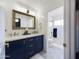 Beautiful bathroom with double sink, and tiled bath with glass doors at 12403 W Monte Vista Rd Rd, Avondale, AZ 85392