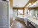Bright bathroom with a double vanity, glass shower, and soaking tub with a view at 12403 W Monte Vista Rd Rd, Avondale, AZ 85392