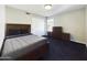 This is a bedroom featuring carpet floors, light walls, and closet at 12403 W Monte Vista Rd Rd, Avondale, AZ 85392