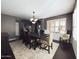 Inviting dining room with a large table, comfortable seating, a stylish chandelier, and modern décor at 12403 W Monte Vista Rd Rd, Avondale, AZ 85392