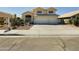 Charming two-story home featuring a three-car garage, well-maintained landscaping, and a welcoming entrance at 12403 W Monte Vista Rd Rd, Avondale, AZ 85392