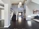 Spacious foyer featuring hardwood floors, high ceilings, a staircase, and an open view of the home's interior at 12403 W Monte Vista Rd Rd, Avondale, AZ 85392
