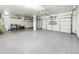 Spacious three car garage with epoxy flooring and plenty of room for storage at 12403 W Monte Vista Rd Rd, Avondale, AZ 85392