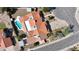 Bird's eye view of a home with a red tile roof, private pool, and well-maintained landscaping at 12448 N 76Th St, Scottsdale, AZ 85260