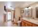 Bathroom featuring a walk-in shower, tile floors, and a vanity with double sinks at 12448 N 76Th St, Scottsdale, AZ 85260
