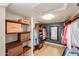 Walk-in closet with custom shelving, hardwood floors, and a large mirror at 12448 N 76Th St, Scottsdale, AZ 85260